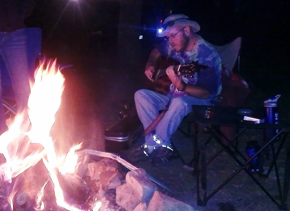 Playing Acoustic Guitar at a Campfire